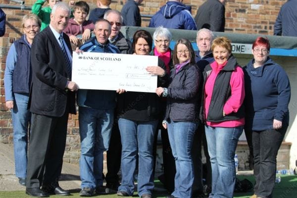 Supporters Club Cheque Presentation to Neill Wilson